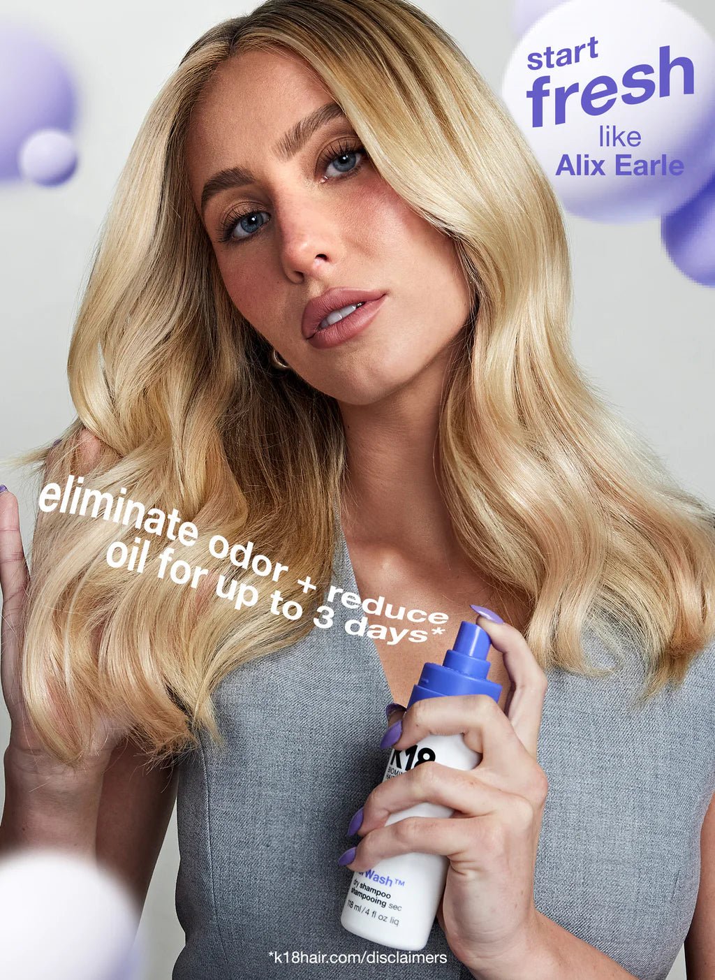 A person with long blonde hair holds a spray bottle of K18 AirWash Dry Shampoo by Simply Colour Hair Salon Studio & Online Store while looking at the camera. Text on image reads, "eliminate odor + reduce oil for up to 3 days*.