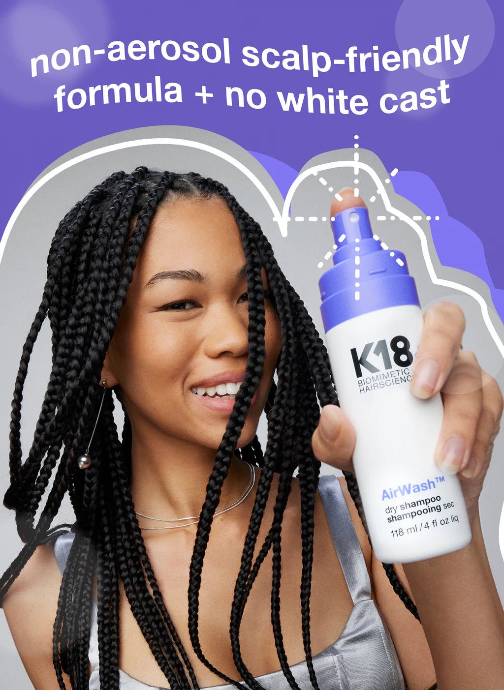A person with braided hair holds a bottle of K18 AirWash Dry Shampoo from Simply Colour Hair Salon Studio & Online Store. Text above reads, "non-aerosol scalp-friendly formula + no white cast, reduces oil with odorBIND biotechnology".