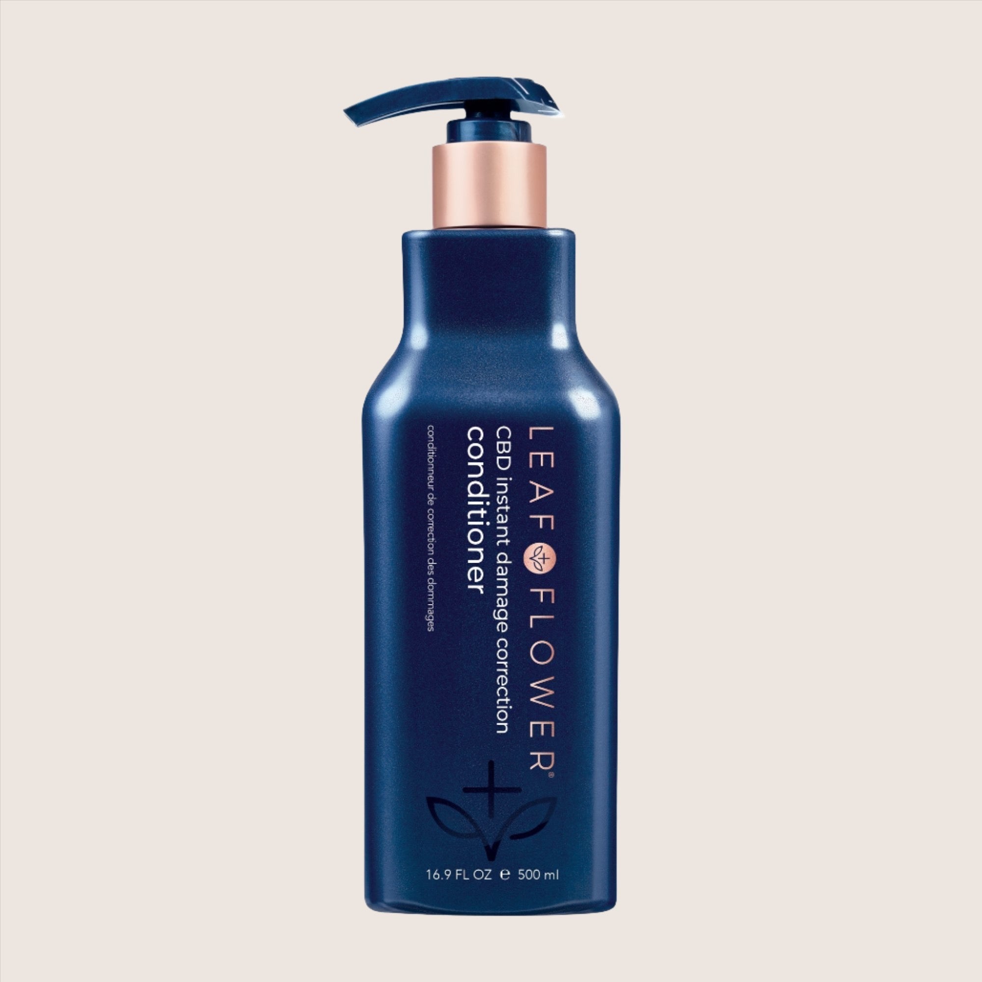 Leaf and Flower's LEAF and FLOWER Damage Correction Conditioner in dark blue, with plant-based, color-safe formula and pump dispenser, 16.9 fl oz (500 ml).