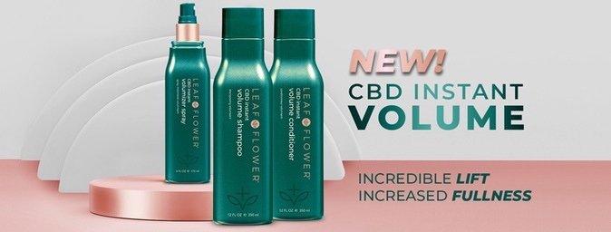 Green bottles of Leaf and Flower LEAF and FLOWER Instant Volume Shampoo against a pink and white background. Text highlights features: "Incredible Lift, Increased Fullness" and "NEW! LEAF and FLOWER Instant Volume Shampoo." This plant-based, sulfate-free formula promises lush, voluminous hair.