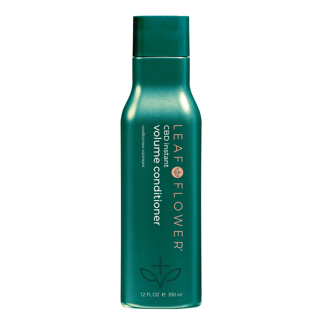 A green bottle of Leaf and Flower LEAF and FLOWER Instant Volume Conditioner, 12 fl oz (350 ml), features a color-care conditioner with Corrective Complex for enhanced hair health.
