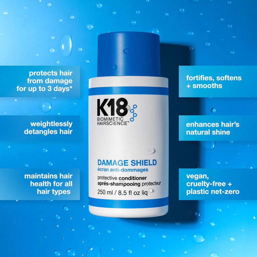 A bottle of K18 Hair Repair K18 Damage Shield pH Protective Conditioner - Multiple Sizes with highlighted features: protection, fortification, detangling, enhancing shine, maintaining hair health, and vegan, cruelty-free, plastic net-zero attributes. Enriched with K18PEPTIDE™, this nourishing conditioner ensures optimal care for your locks.