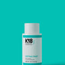 A white bottle of K18 PEPTIDE PREP Detox Shampoo - Multiple Sizes, a color-safe clarifying shampoo with deep cleanse properties, featuring turquoise accents on a matching background. The 250 mL (8.5 fl oz) bottle proudly showcases the K18 Hair Repair logo.