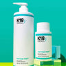 Two K18 Hair Repair bottles labeled "K18 PEPTIDE PREP Detox Shampoo - Multiple Sizes" against a teal background. The larger bottle holds 930 ml (31.5 fl oz) and the smaller bottle holds 250 ml (8.5 fl oz). This K18PEPTIDE™ formula offers a deep cleanse with a color-safe clarifying shampoo, perfect for maintaining vibrant, healthy hair.